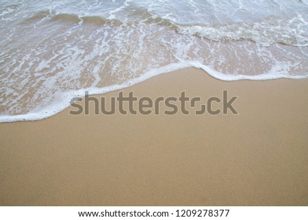 Soft wave of sea on the sand beach 