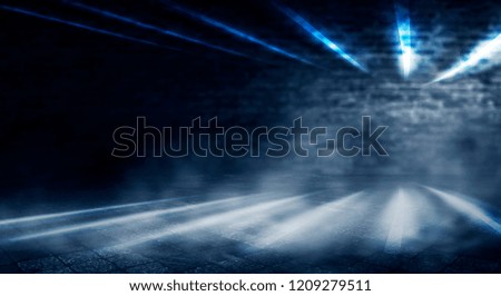 Background of an empty room with a brick wall, searchlight lights, neon light.