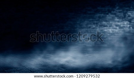 Background of an empty room with a brick wall, searchlight lights, neon light.
