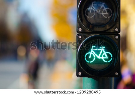 Sustainable transport. Bicycle traffic signal, green light, road bike, free bike zone or area, bike sharing Royalty-Free Stock Photo #1209280495
