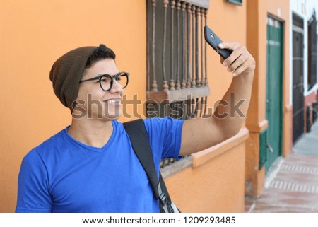 Young hip male taking a selfie