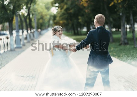 Bride and groom whirl