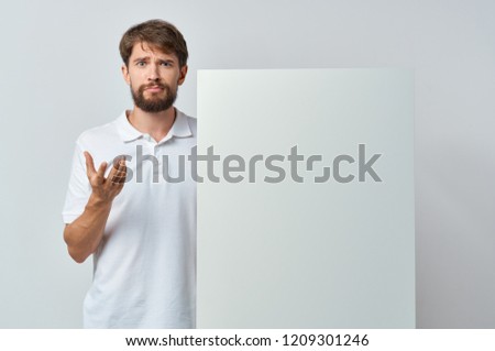 angered man holding white mockup                    