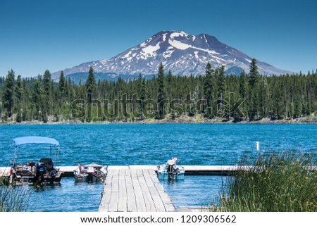 Lava Lake, along the Cascade Lakes Scenic Byway near Bend Oregon, with Mt. Bachelor in the backgrou Royalty-Free Stock Photo #1209306562