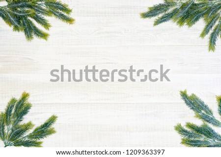 Festive composition of Christmas decorations on white wooden background. Flat lay with copy space. New year holiday frame. Royalty-Free Stock Photo #1209363397