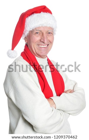 Portrait of happy senior man in Santa hat isolated