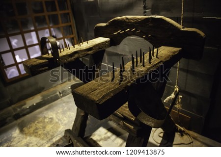 Medieval instrument of torture, detail of torture in the inquisition Royalty-Free Stock Photo #1209413875