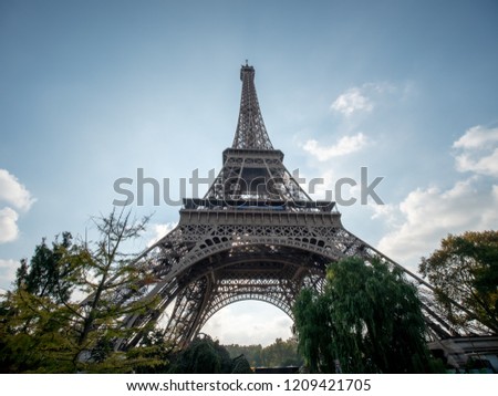 Wide Angle Picture of the Eiffel Tower With Trees in the Foreground