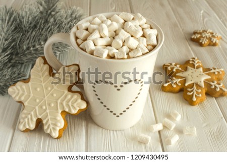 Hot chocolate with marshmallows  and Christmas composition on the white   wooden background