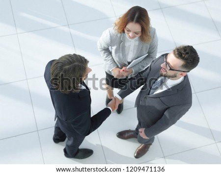 Closeup picture of businesspeople shaking hands.