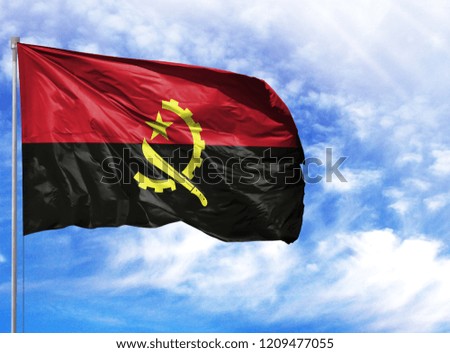National flag of Angola on a flagpole