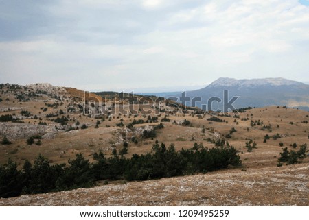 View of cliffs and rocks of Crimean mountains near Alushta by early autumn, Russia