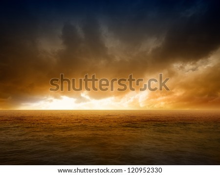 Abstract apocalyptic background - dramatic red sunset over sea, end of world Royalty-Free Stock Photo #120952330