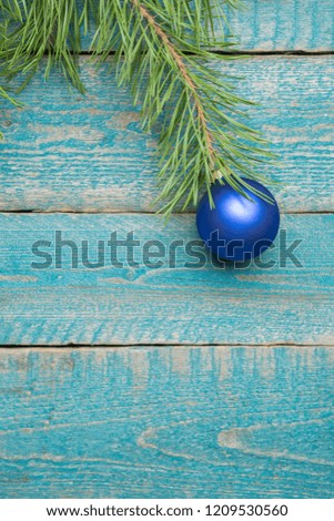 Christmas Decoration With blue bauble Over blue Wooden Background. Decorations over Wood. Vintage