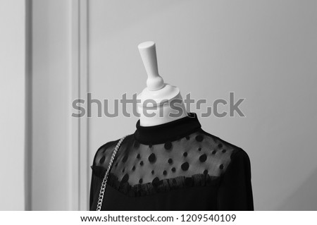 Black dress on a white dummy - Minimal and fashion (Italy, Europe)