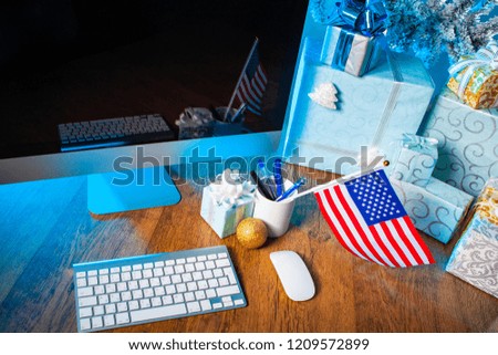 Gifts for Christmas. Gifts on the table. Place for congratulations on Christmas. New Year. New Year's greetings. Computer monitor for the inscription. Christmas in America. flag of USA.