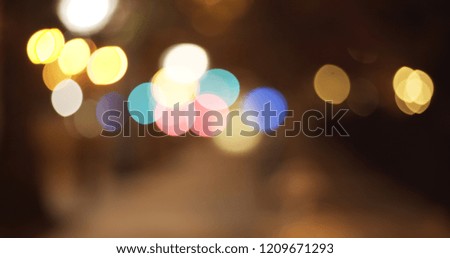 Blurred backdrop of pretty bokeh lights in urban setting