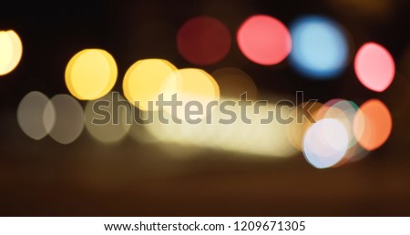 Out of focus backdrop of bokeh lights and urban traffic
