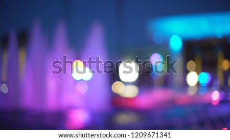 Defocused Background plate of fountain with colorful illuminations at night