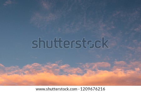 The weather settles & the clouds display beautiful warm tones after a thunderstorm/A simple cloudscape wallpaper design. This photo was taken in Brisbane, Australia. 