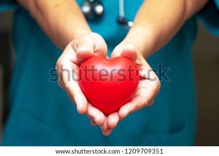 Physician/doctor shows a red heart. Medical concept Royalty-Free Stock Photo #1209709351