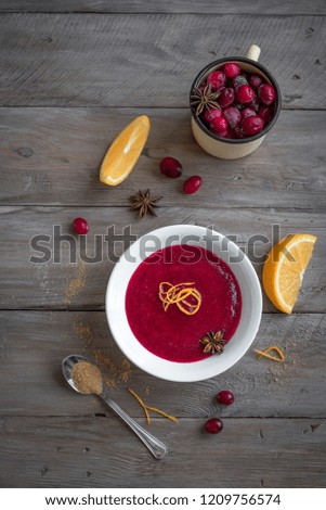 Homemade Cranberry Orange Sauce (Relish) for Thanksgiving or Christmas on wooden, copy space. Traditional festive Cranberry Sauce with ingredients.