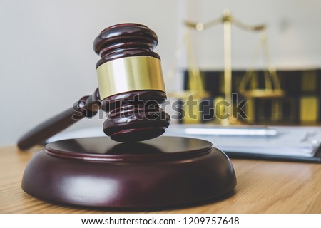 Scales of justice and Gavel on sounding block, object and law book to working with judge agreement in Courtroom, Justice and Law concept.