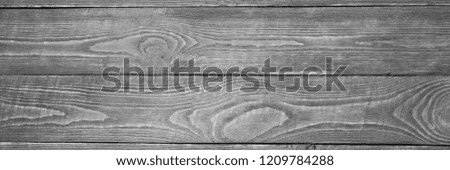 The background of the wooden texture boards black and white. Horizontal. Narrow.