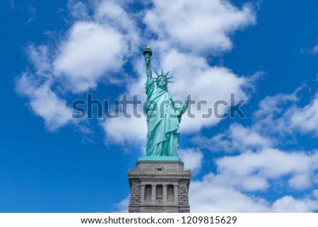 Front view of The Statue of Liberty with blue sky on a sunny day, New York City, USA