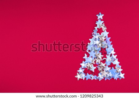 Christmas tree of stars on red background