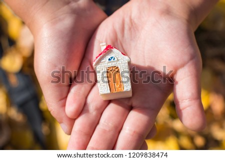 figure of the house in hand. Concept