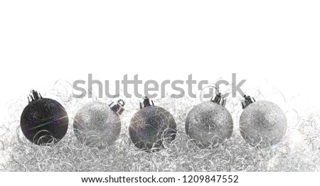 Christmas tree balls and angel hair as christmas decoration against white background