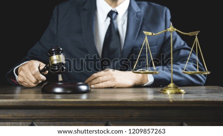 Legal law, Judge gavel with Justice lawyers advice with gavel and Scales of justice, Counselor or Male lawyer working on courtroom sitting at the table and papers.
