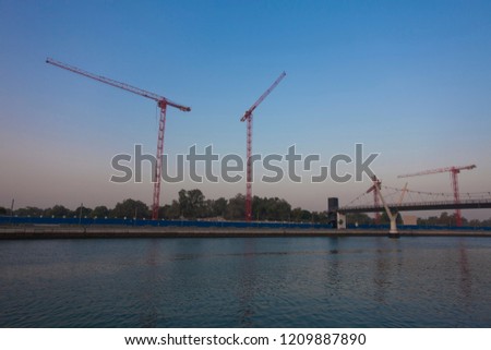 silhouette of construction cranes, industrial photo