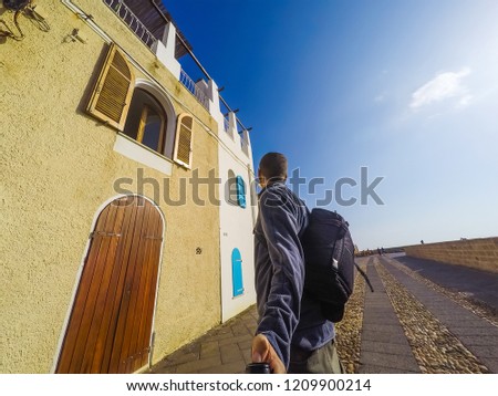 Man in Alghero seafront. Sardinia, Italy