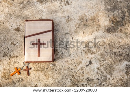 The Holy Bible with concrete background. Christianity concept. Faith hope love concept.