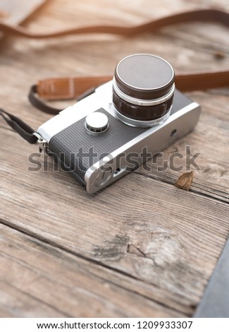Old retro camera on a wooden background,Copy space