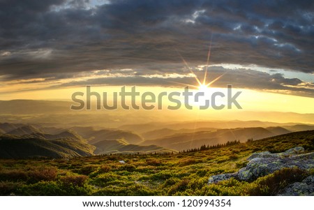 Majestic sunset over the Little Mountain Peak. Picture is made from 9 frames with exposure blending method and the help of a star filter for the sun effect.