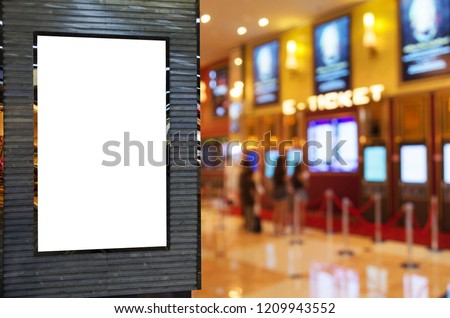 blank showcase billboard or advertising light box for your text message or media content with blurred image of ticket sales counter at movie theater, advertisement, marketing, entertainment concept