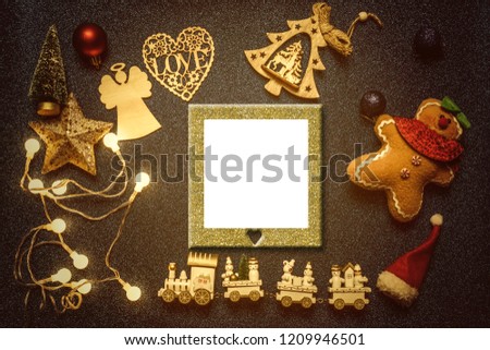 Empty picture frame Christmas greeting card. Frame to put photo surrounded by ornaments for the christmas tree on bright background