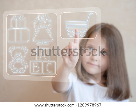 Business, e-business, technology and internet concept - little girl pressing add to cart button. Cute child in toy online shop. Young shopper pointing finger to shopping trolley icon on virtual screen