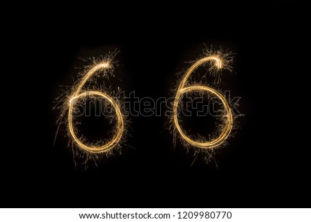 Alphabet and Numbers sparklers on black background