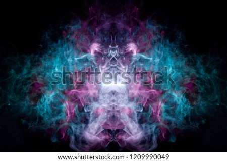 Fantasy print for clothes: t-shirts, sweatshirts. Thick colorful smoke of pink, blue colors smoke in the form of a skull, monster, dragon on a black isolated background. Background from the smoke 