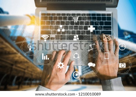 Coding software developer work with augmented reality dashboard computer icons  with responsive cybersecurity.Businessman hand working.