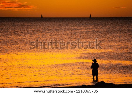 Landscape of silhouettes persons orange colors and contrast