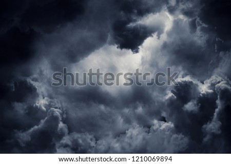 Dark moody storm clouds. Ominous warning. Royalty-Free Stock Photo #1210069894
