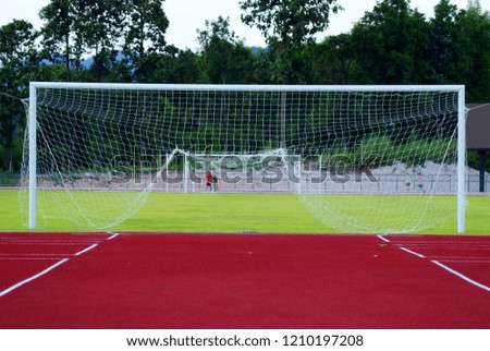 Selective focus picture back view of net and goal for football game