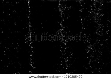 Abstract background texture.surface water drop on black background. free transformation liquid and spread element concept.