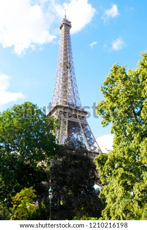 Eiffel Tower in Paris on a bright sunny day, France.