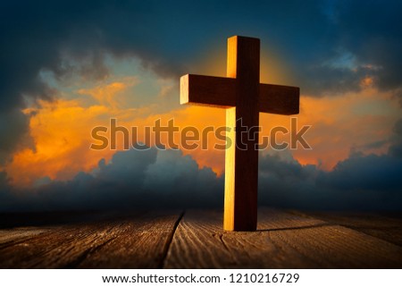 Christian wood cross on sunset sky wooden made